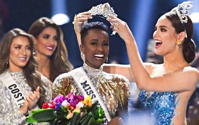 Miss Universe 2018 Philippines’ Catriona Gray crowns the new Miss Universe, South Africa’s Zozibini Tunzi, during the 2019 Miss Universe pageant at Tyler Perry Studios in Atlanta on Dec. 8, 2019. 