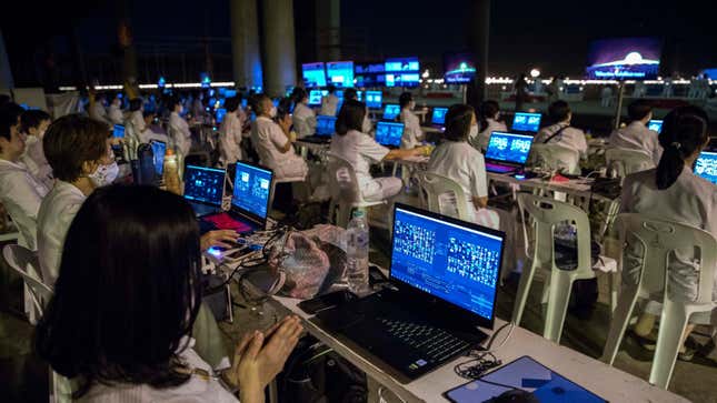 Volunteers manage a global Zoom call of over 200,000 participants at Wat Dhammakaya on February 26, 2021 in Bangkok, Thailand.
