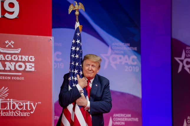 Image for article titled Watch: Where Are All the Flag Lovers Now? Trump Plays and Points During the National Anthem