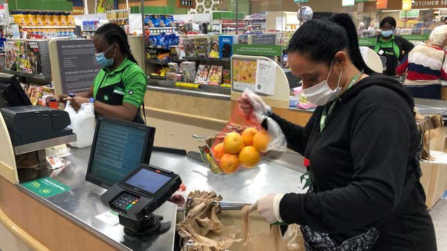 An Instacart shopper bagging groceries 