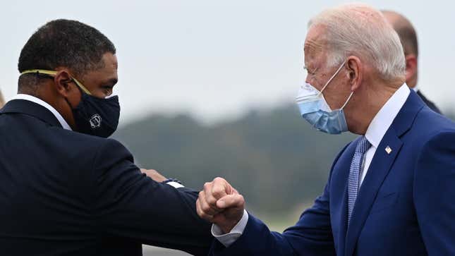 Biden bumps elbows with Rep. Cedric Richmond, who has taken big bucks from the fossil fuel and petrochemical industry.