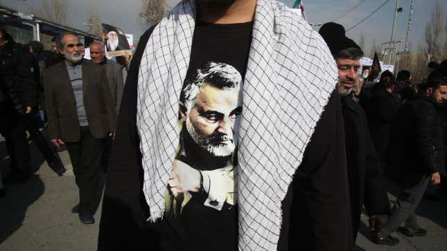 An Iranian resident wearing a t-shirt with the face of slain Quds Force commander Qassem Soleimani at a protest in Tehran on Jan 3., 2020.