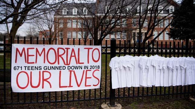 T-shirts mourning teen victims of gun violence hang on a fence in front of Bethesda-Chevy Chase High School on February 14, 2019, on the one-year anniversary of the shooting at Marjory Stoneman Douglas High School in Parkland, Florida, where 17 students and teachers were killed.