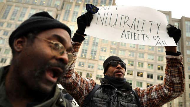  Demonstrators rally outside the Federal Communications Commission building to protest against the end of net neutrality rules Dec. 14, 2017, in Washington, D.C. 