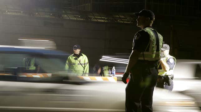 U.S. Capitol Police officers check vehicles before they drive past the U.S. Capitol November 17, 2004 in Washington, DC. The security checkpoints have recently returned to locations around the Capitol.