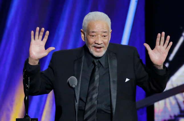 This April 18, 2015 file photo shows singer-songwriter Bill Withers speaking at the Rock and Roll Hall of Fame Induction Ceremony in Cleveland. 