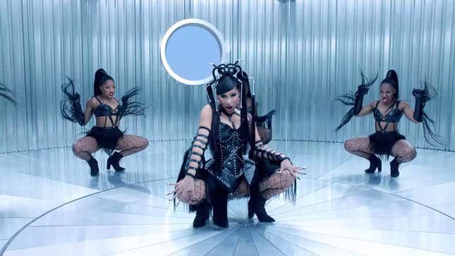 Image for article titled Cardi B Using a White Man As a Table, and Other Important Moments from the 'Up' Video