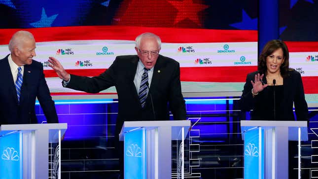 Sen. Kamala Harris (D-Calif.) and former Vice President Joe Biden flank Sen. Bernie Sanders (I-Vt.), during the second night of the Democratic presidential primary debate June 27, 2019, in Miami.