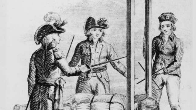 A victim undergoes execution by guillotine during the French Revolution, circa 1793.