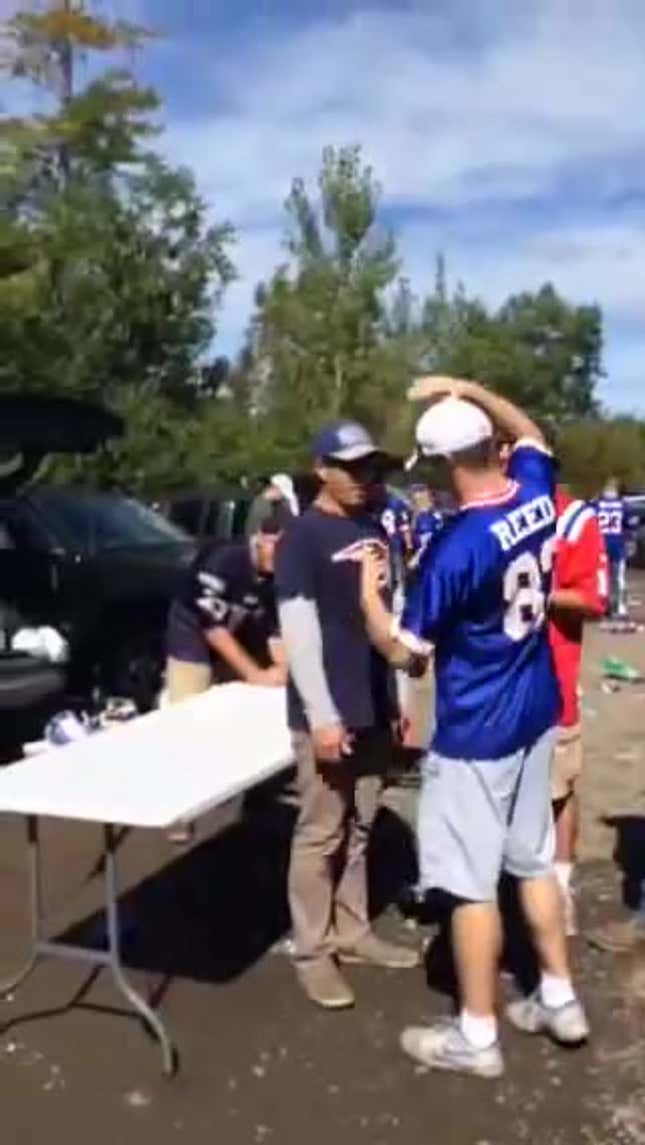 Bills Fan Uses Teamwork To Slam Patriots Fan Through Table