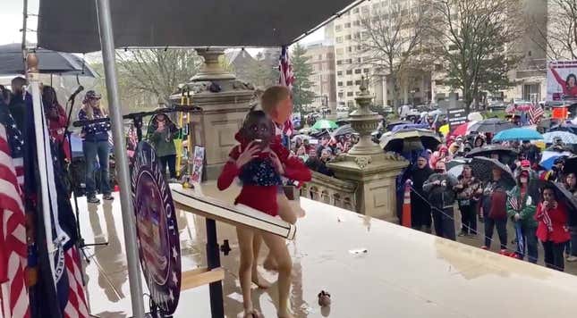 Two children in Karen training dance during an “Open up Arbys” protest. 