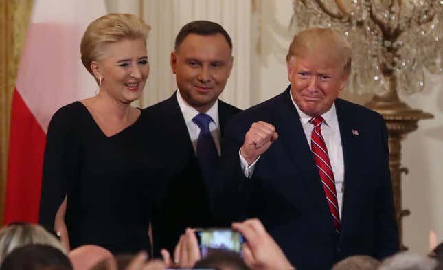 President Donald Trump, right. participates in a Polish-American reception with the President of Poland Andrzej Duda and his wife Agata Kornhauser-Duda in the East Room at the White House on June 12, 2019 in Washington, DC