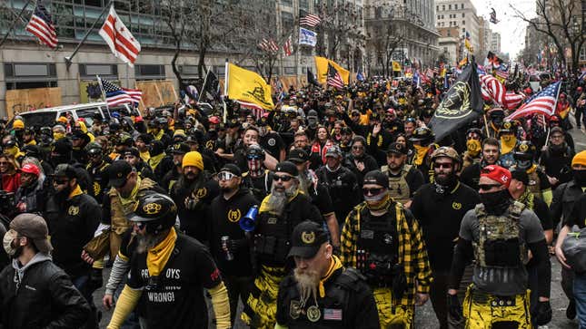 Members of the Proud Boys march towards Freedom Plaza during a protest on December 12, 2020 in Washington, DC. Thousands of protesters who refuse to accept that President-elect Joe Biden won the election are rallying ahead of the electoral college vote to make Trump’s 306-to-232 loss official. 