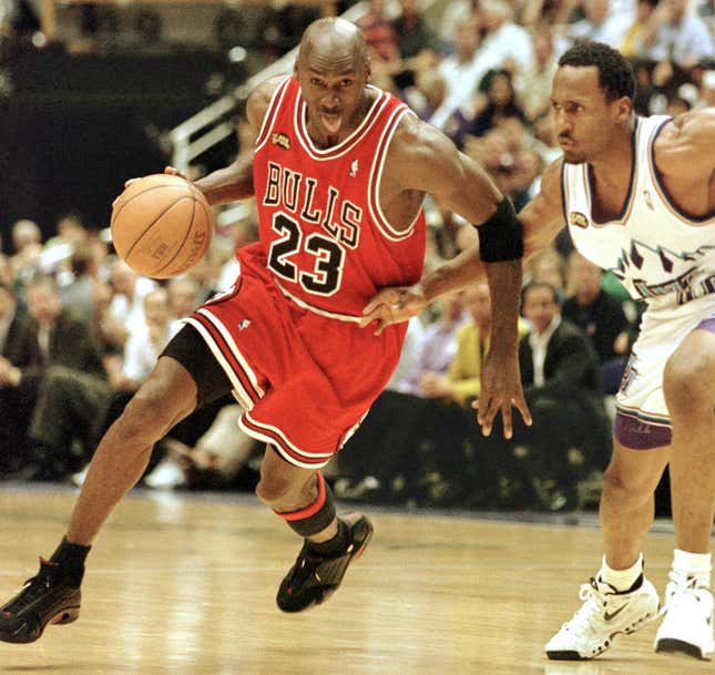 Michael Jordan of the Chicago Bulls goes to the basket past Shandon Anderson of the Utah Jazz during Game 6 of the NBA Finals in Salt Lake City, UT.