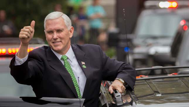 Vice President Mike Pence give a crowd a thumbs-up right before climbing into his motorcade at the Savannah St. Patrick’s Day parade.