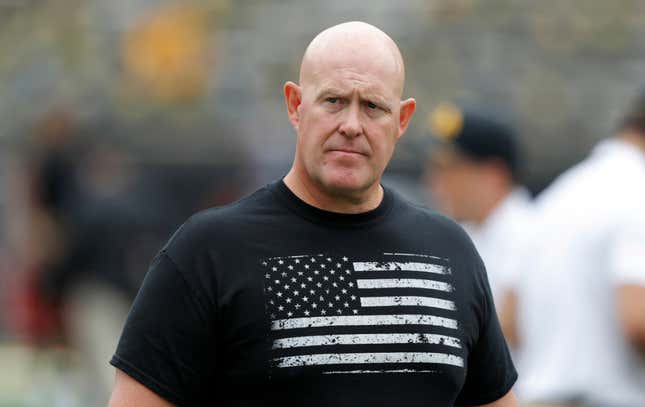 In this Sept. 1, 2018, file photo, Iowa strength and conditioning coach Chris Doyle walks on the field before an NCAA college football game between Iowa and Northern Illinois, in Iowa City, Iowa. Former players have accused Doyle of bullying and making racist comments.