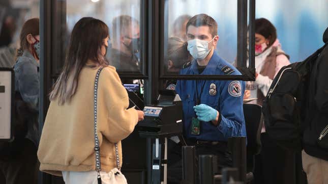 A Transportation Security Administration (TSA) agent screens an airline passenger at O’Hare International Airport on October 19, 2020 in Chicago, Illinois.