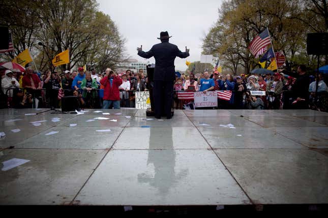 Former Presidential candidate Herman Cain speaks at a Tea Party Patriots’ ‘Road To Repeal Rally’ on a rainy day March 24, 2012 in Washington, DC.