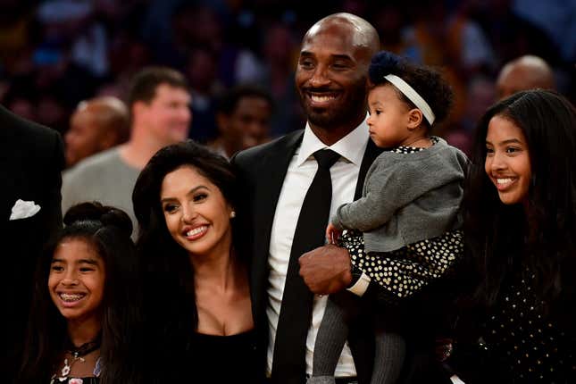 Kobe Bryant poses with his family after both his #8 and #24 Los Angeles Lakers jerseys are retired at Staples Center on December 18, 2017 in Los Angeles.