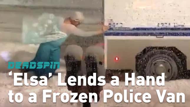 Guy In A <i>Frozen</i> Costume Pushing A Police Van Out Of The Snow?