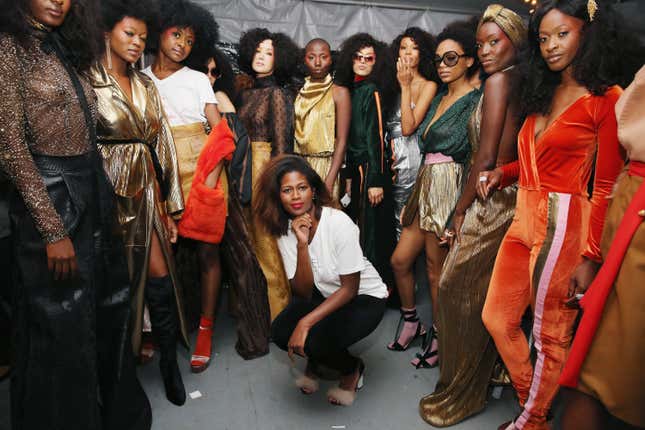 Fashion designer, Fe Noel (C), poses backstage during Harlem’s Fashion Row Celebrates 10th Anniversary Style Award and Fashion Show on September 6, 2017 in New York City.