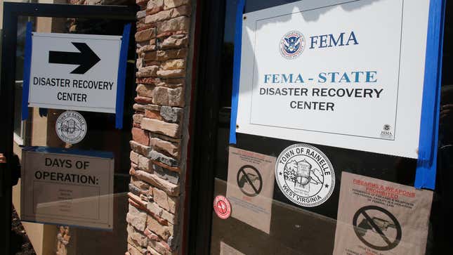 FEMA Disaster Recovery signs direct residents to help in Rainelle, W. Va., in August 2016. A former West Virginia nonprofit director is headed to prison for defrauding FEMA of $18,000 in disaster funds.