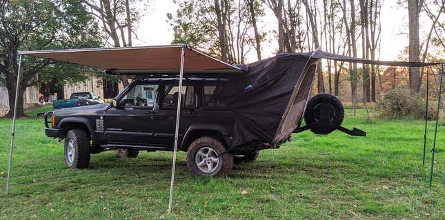 Image for article titled Hero Saves Official Pontiac Aztek Tent From Junkyard, Installs It On His Jeep Cherokee XJ