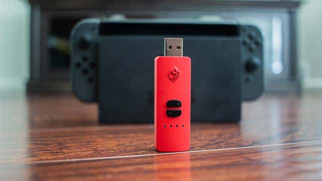 Image for article titled This Red Little Devil of a USB Stick Allows Any Controller on Nintendo Switch and Makes Pokémon Sword and Shield Ten Times Easier
