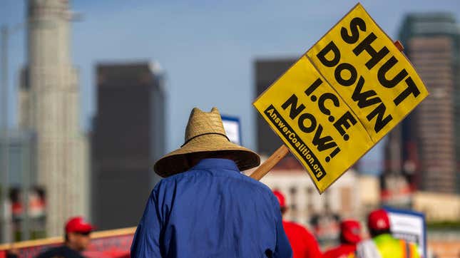 A man calls for the shutdown of the U.S. Immigration and Customs Enforcement agency during a march May 1, 2019, in Los Angeles. ICE authorities are expected to conduct a major crackdown on immigrants in Los Angeles and in major cities across the nation, beginning Sunday, June 23, 2019.