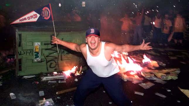 Image for article titled Red Sox Fan Dedicates Garbage Can He’s Lighting On Fire To Marathon Victims