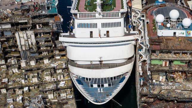In this aerial view from a drone, luxury cruise ships are seen being broken down for scrap metal at the Aliaga ship recycling port on October 02, 2020 in Izmir, Turkey.