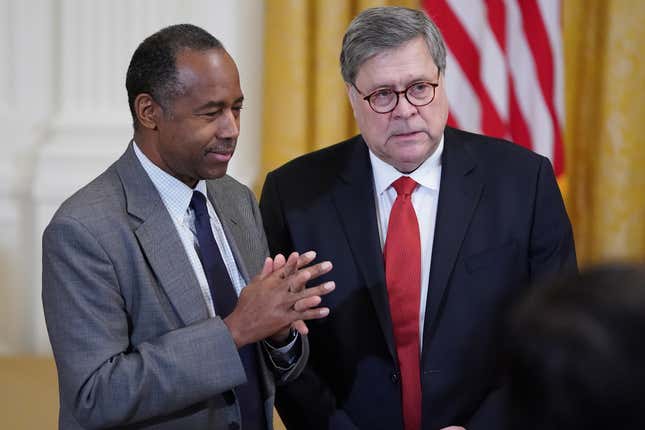 Housing and Urban Development Secretary Ben Carson (L) and Attorney General William Barr attend a First Step Act celebration in the East Room of the White House April 01, 2019 in Washington, DC.