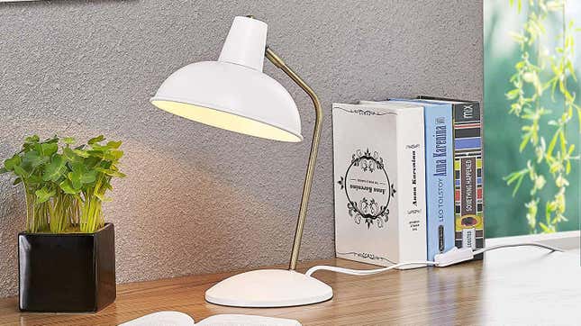 Industrial lighting shapes will never go out of style, but this table lamp gets a chic upgrade with a brass arm and multiple color options.
