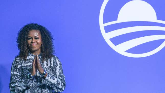 Former US first lady Michelle Obama arrives to attend an event for the Obama Foundation in Kuala Lumpur on December 12, 2019.