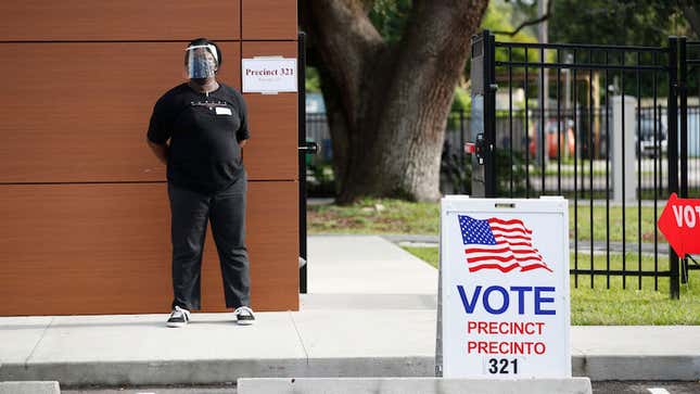 Deputy polling precinct worker Seandra Pinder waits for voters to cast their ballot in Florida’s primary election at Precinct 321 on August 18, 2020 in Tampa, Florida.