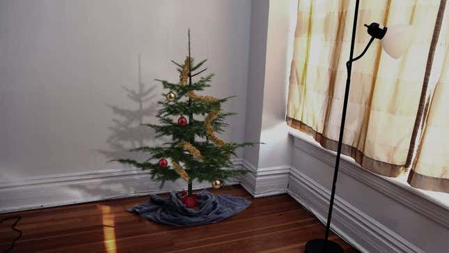 Image for article titled 3-Foot-Tall Christmas Tree Really Completes Incredibly Depressing Apartment
