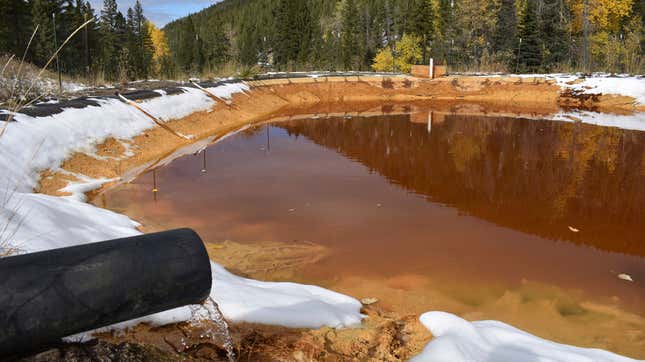 Water contaminated with arsenic, lead, and zinc flowing from a pipe out of the Lee Mountain mine and into a holding pond near Rimini, Montana. The pond is part of the Upper Tenmile Creek Superfund site.