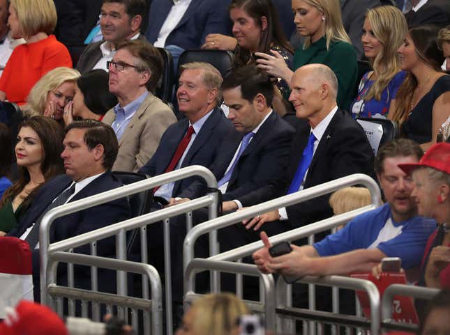  Florida Gov. Ron DeSantis (front row) Lindsey Graham (R-SC), Sen. Marco Rubio (R-FL) and Sen. Rick Scott (R-FL) listen as U.S. President Donald Trump announces his candidacy for a second presidential term on June 18, 2019 in Orlando, Florida. 