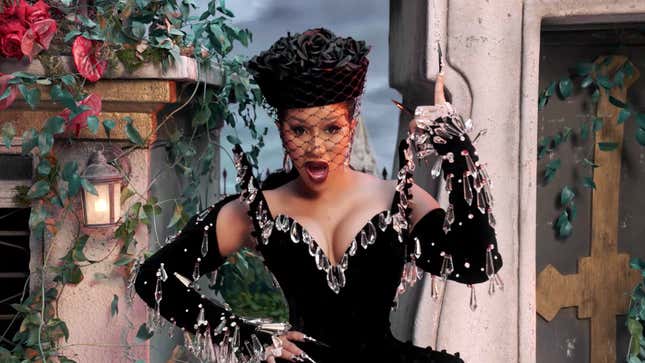 Image for article titled Cardi B Using a White Man As a Table, and Other Important Moments from the 'Up' Video