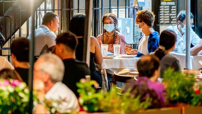 Masked diners at a restaurant