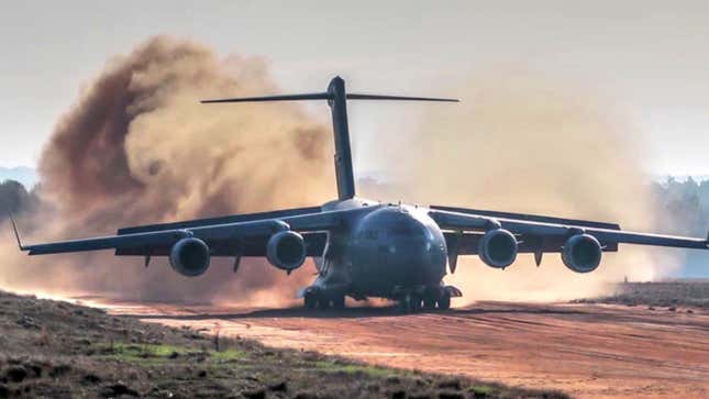 Watch This C-17 Plop Down On A Dirt Airstrip And Cough Up Two Apaches Like A Boss