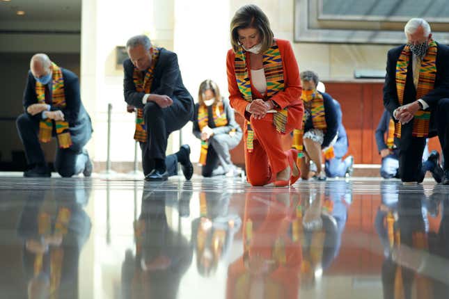 Sen. Cory Booker (D-NJ), Senate Minority Leader Charles Schumer (D-NY), Sen. Kamala Harris (D-CA), Speaker of the House Nancy Pelosi (D-CA), Rep. Karen Bass (D-CA) and House Majority Leader Steny Hoyer (D-MD) join fellow Democrats from the House and Senate kneel in silence for eight minutes and 46 seconds to honor George Floyd in the U.S. Capitol Visitors Center June 8, 2020 in Washington, DC.