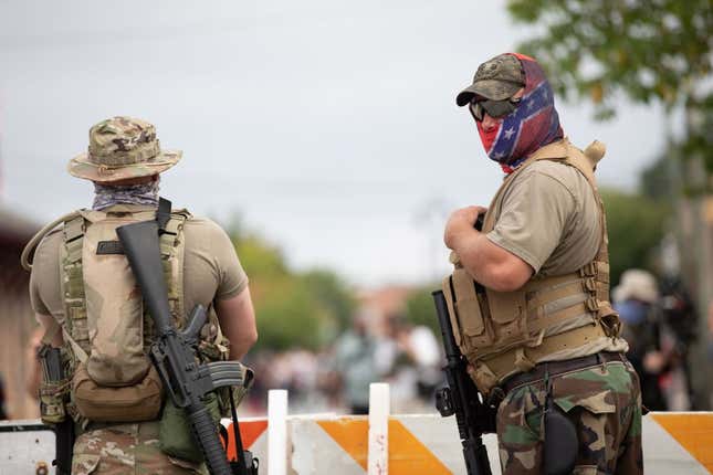 Members of far right militias and white pride organizations rally near Stone Mountain Park in Stone Mountain, Georgia on August 15, 2020.