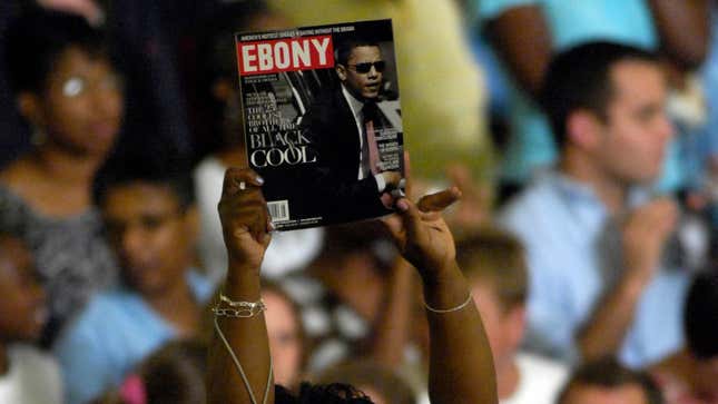 A supporter holds up an issue Ebony magazine featuring Barack Obama before a speech at a campaign event billed as a town hall meeting August 19, 2008.