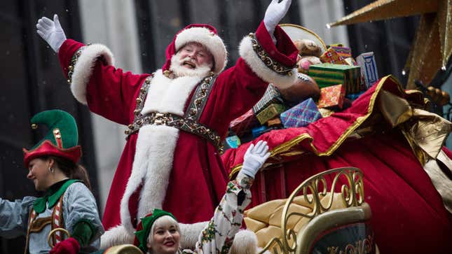 Santa Claus waves to the crowd during the Macy’s Thanksgiving Day Parade on Nov. 27, 2014 in New York City.