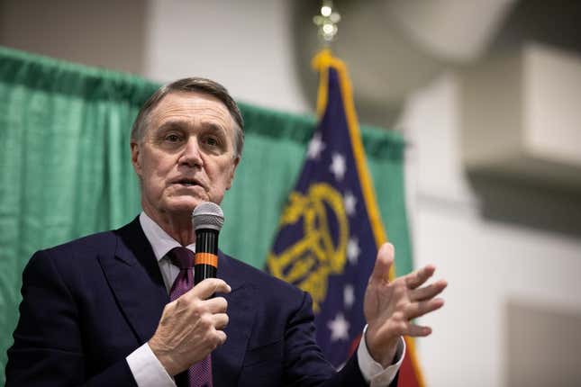  U.S. Sen. David Purdue (R-Ga.) speaks to the crowd of supporters during a “Defend the Majority” rally at the Georgia National Fairgrounds and Agriculture Center on November 19, 2020 in Perry, Georgia. Purdue is facing Democratic U.S. Senate candidate Jon Ossoff in a January 5th runoff race. 