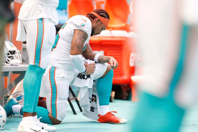 Albert Wilson of the Miami Dolphins kneels during the playing of the national anthem prior to the game against the Baltimore Ravens at Hard Rock Stadium on September 8, 2019 in Miami, Florida.