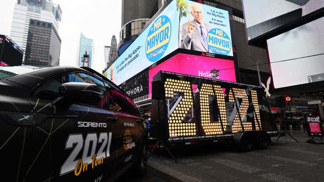 The New Year’s Eve numerals are lit up while on display in Times Square next to the KIA car which brought the numbers in a cross country trip on December 21, 2020 in New York City.