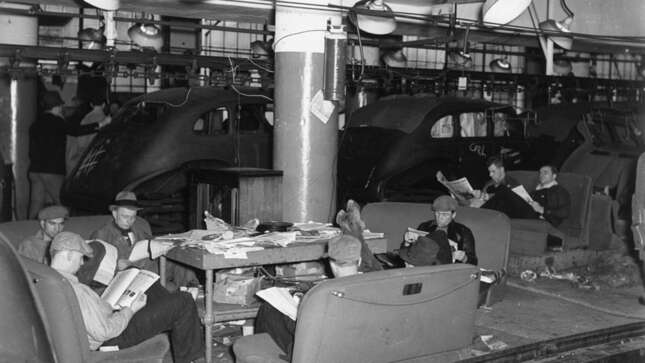 Members of the nascent United Auto Workers Union (UAW) during a sit-down strike in the General Motors Fisher Body Plant in Flint, Michigan in 1937. Photo credit Getty Images