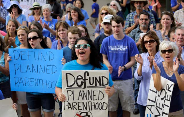 In this July 28, 2015 file photo, anti-abortion activists rally on the steps of the Texas Capitol in Austin, Texas. 